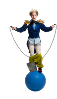 Drew the Dramatic Fool: balanced on a circus ball, foot in bucket, pants down, jumping rope.